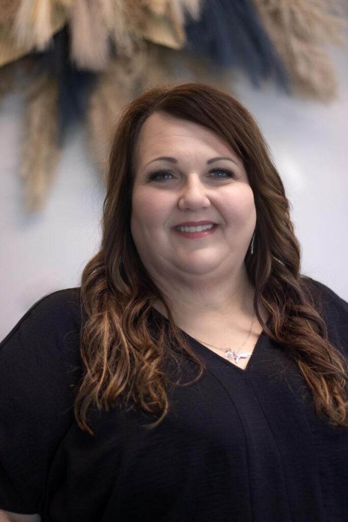 Headshot of Lisa West, master stylist of the studio salon.