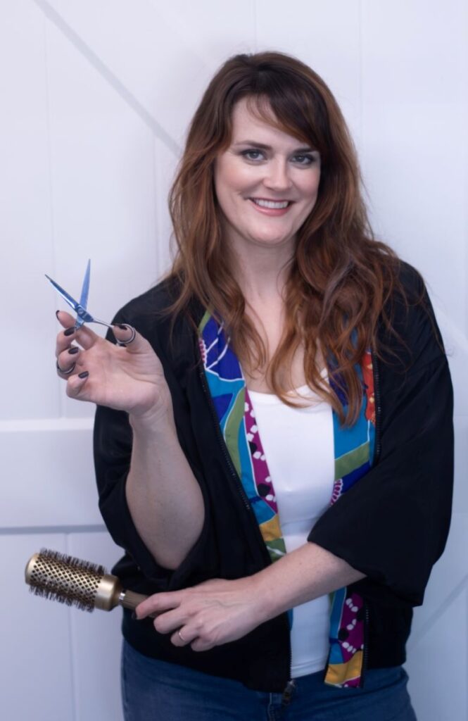 Mollie Mcdonald, hair stylist of the studio with hair cutting scissors. Looking fly!